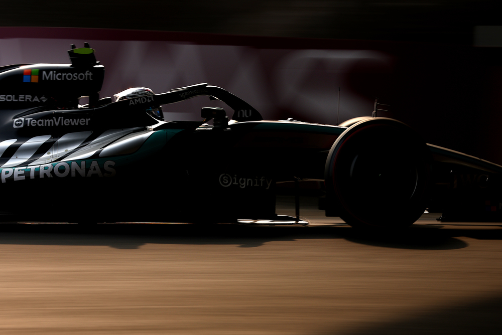 Mercedes Formula 1 car in low light on track