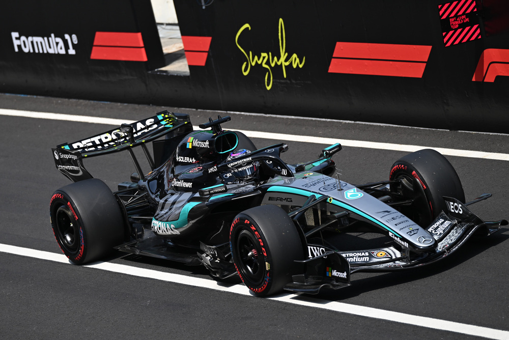 Mercedes Formula 1 car on track with sponsor branding