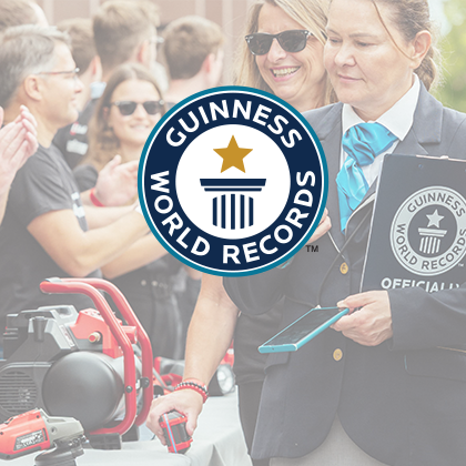 The Guinness World Records logo over an event photo showing Einhell tools.